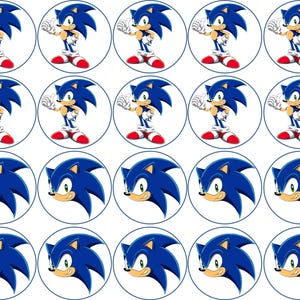 May include: Twenty-four round cupcake toppers featuring a blue cartoon character with a red and white design. The character has a white face with black eyes and a red nose. The character is wearing white gloves and red shoes.