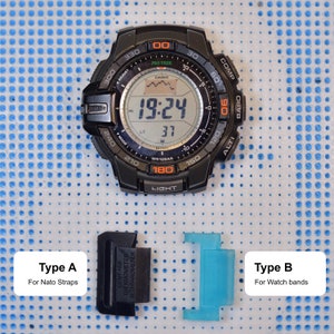 May include: Two types of watch band spring bars. Type A is black and says "Compass, Thermometer, Alt/Barometer". Type B is blue.