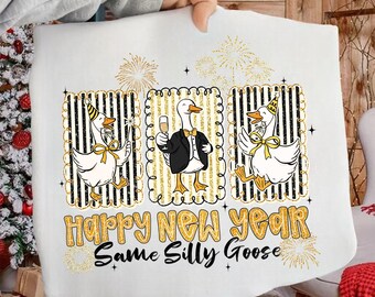 May include: White New Year's themed graphic featuring three cartoon geese in party hats and bow ties. The geese are in gold and black striped frames, with the text "Happy New Year, Same Silly Goose" in gold lettering. Fireworks and stars are also included.