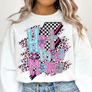May include: White sweatshirt with a graphic design that says "Hot Mess Mama" in pink, blue, and black letters with a checkered pattern and leopard print accents.