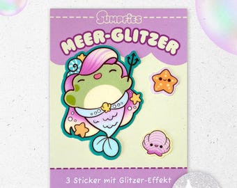 May include: A sticker sheet titled Sumpfies Meer-Glitzer featuring three glitter-effect stickers: a green frog mermaid with a pink and blue tail holding a trident, a small orange smiling starfish, and a light purple smiling seashell on a light background.