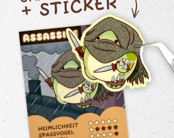 May include: A sticker and trading card set featuring a cartoon assassin character. The assassin is a green, pear-shaped figure wearing a brown head covering and holding a knife. The card has the word "ASSASSI" and German text. The sticker is being peeled from the card.