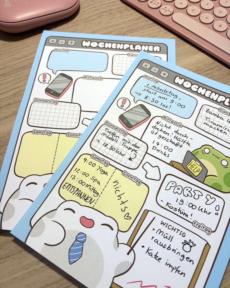 May include: Two light blue weekly planner sheets with a digital interface design. The pages feature sections for each day of the week, including handwritten German text, illustrations of a smartphone, a frog with a help sign, and a smiling creature.