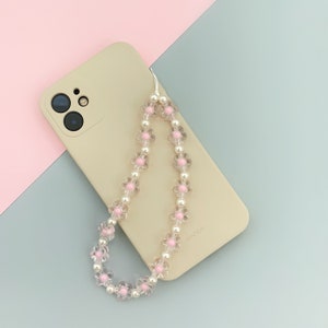 Pinkes Handyband mit Blumenmuster