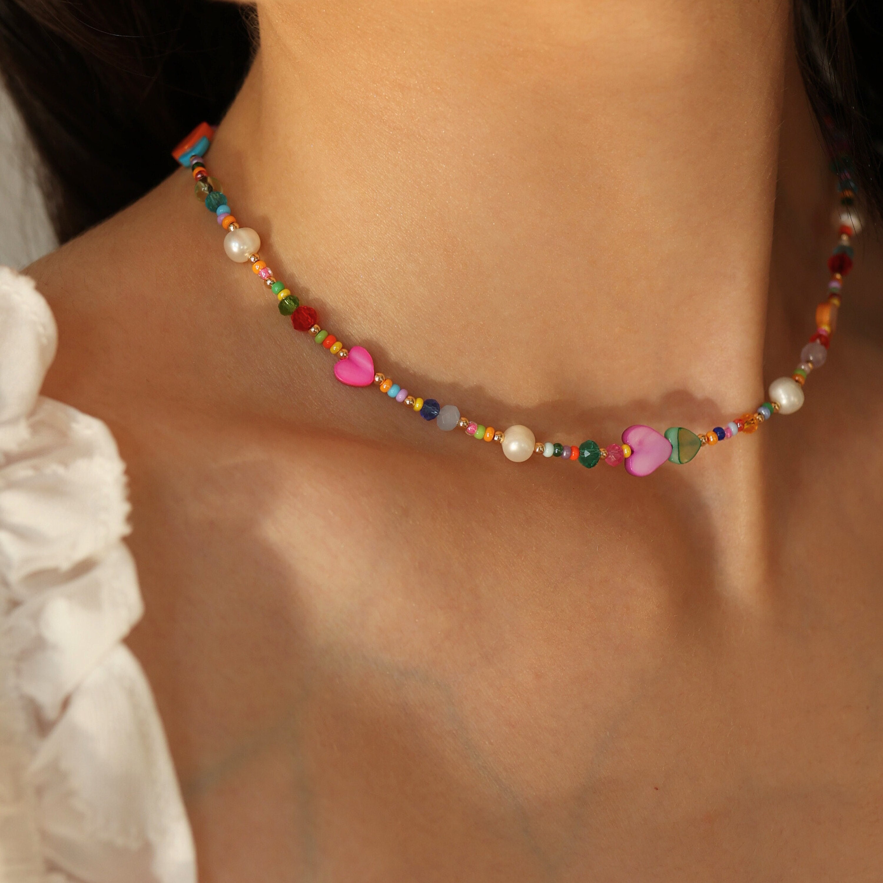 Colorful beaded necklace with crystals, heart shells, freshwater pearls and 18K gold plated beads
