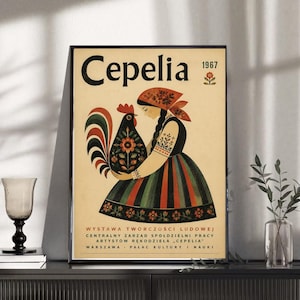 May include: A vintage-style poster featuring the text Cepelia 1967. The illustration depicts a person wearing a headscarf and a striped skirt, holding a stylized rooster with floral patterns. The bottom text reads Wystawa Twórczości Ludowej.