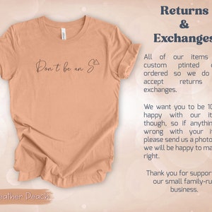 May include: A heather peach coloured t-shirt with the text "Don't be an S" printed on the front. The text is in black and the shirt is folded in half. The text "Returns & Exchanges" is visible in the upper right corner of the image. The text below explains the shop's return policy.