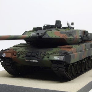 Built Panzer Leopard 2 A5/A6 in 1/35 scale on a wooden base plate image 1