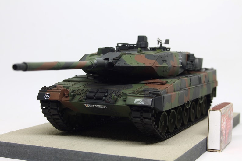 Built Panzer Leopard 2 A5/A6 in 1/35 scale on a wooden base plate image 1