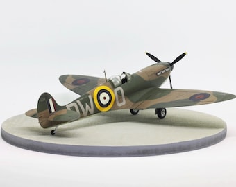 Built Spitfire Mk.II 1/48 model aircraft on a round wooden base plate with concrete pattern