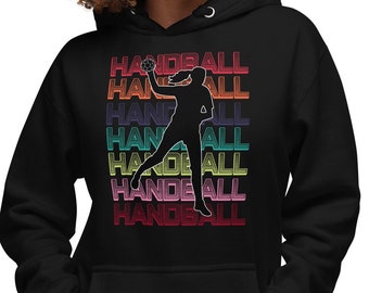 Female handball player with ball in throwing arm with handball background