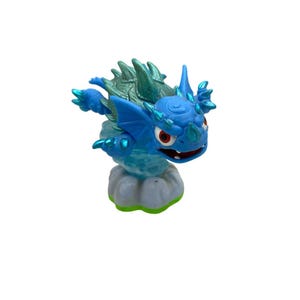 May include: A white ceramic mug with a black handle and the text "But First, Coffee" in a black, handwritten-style font. The mug is on a white surface.