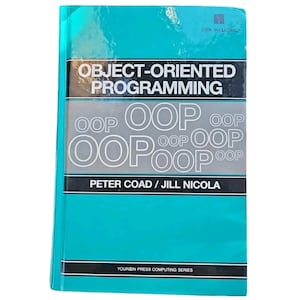 May include: A teal-colored book titled "OBJECT-ORIENTED PROGRAMMING" with the authors Peter Coad and Jill Nicola. The cover features the acronym "OOP" repeated multiple times. The book is part of the Yourdon Press Computing Series.