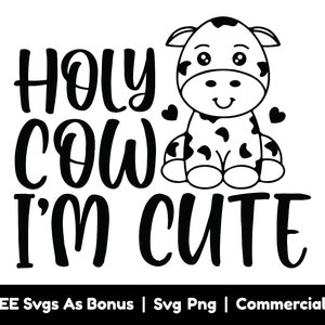 May include: Black and white graphic design featuring a cute cartoon cow with the text "HOLY COW I'M CUTE".
