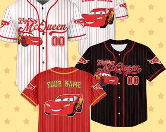 May include: Baseball jerseys with Lightning McQueen designs from the Cars film. The jerseys are red, white, and black with pinstripes. Some have "Lighting McQueen" and the number "00". Others have "YOUR NAME" printed on them.