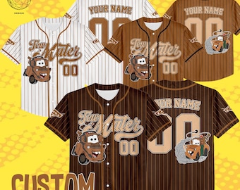 May include: Baseball jerseys in brown and white, featuring a "Tow Mater" design, the number "00", and customisable name options. The jerseys have a pinstripe design and a cartoon image of Tow Mater. The text "CUSTOM ANY REQUESTS" is at the bottom.