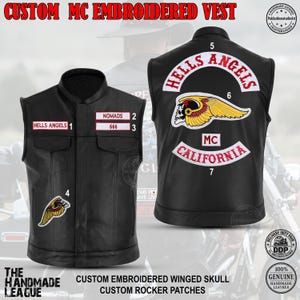 May include: A black leather vest featuring embroidered patches. The front displays 'HELLS ANGELS', 'NOMADS', and '666' with a winged skull patch. The back shows a large 'HELLS ANGELS' rocker, a winged skull emblem, and 'MC CALIFORNIA' text.