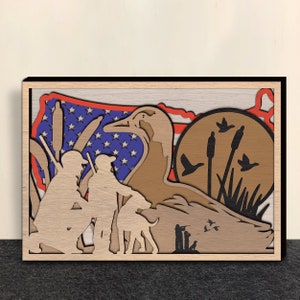 May include: A wooden cutout of a duck with hunters and a dog in front of a stylized American flag. The duck is brown and the hunters are silhouetted in black. The flag is red, white, and blue.