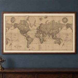 May include: A rectangular framed wall map of the world with a vintage aesthetic, featuring sepia-toned parchment paper and dark brown ink. The text Stanford's Library Map of The World is printed in the lower left corner of the detailed cartographic print.