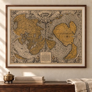 May include: A framed antique-style world map print featuring a dual-hemisphere projection in shades of gold and black. The map includes intricate decorative borders, Latin text such as Nova, Et Integra Universi Orbis Descriptio, and detailed cartographic illustrations of landmasses and oceans.