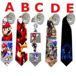 May include: Five neckties with different designs. Tie A features Mario and Sonic characters. Tie B has a red and black design. Tie C has various Sonic characters. Tie D has Sonic characters and the text "SONIC THE HEDGEHOG". Tie E is black with a blue Sonic silhouette.