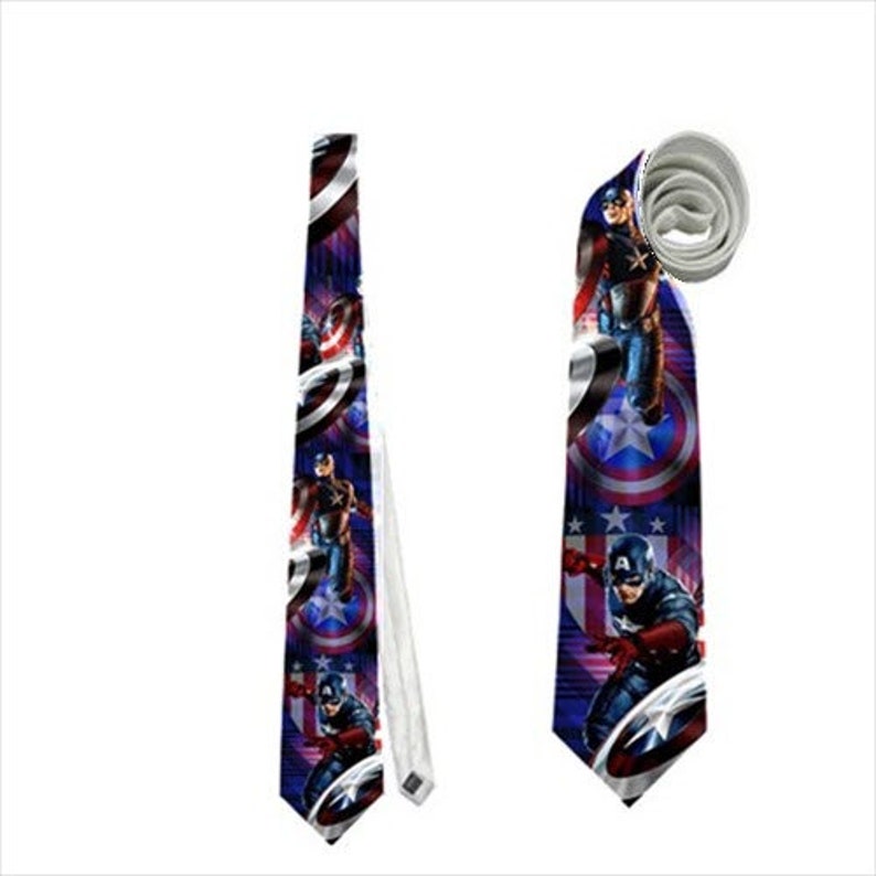 May include: A Captain America themed necktie. The tie features a repeating pattern of Captain America, his shield, and stars on a blue background. The tie is shown both flat and rolled.