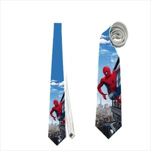 May include: Two blue neckties featuring a Spiderman design. One tie is fully extended, while the other is rolled up. The ties have a blue sky background with clouds and a cityscape. The Spiderman character is in a red and blue suit.