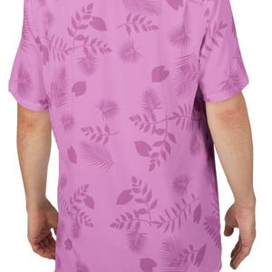 May include: A short-sleeved, button-down shirt in a light purple hue, adorned with a repeating pattern of stylized leaves and botanical elements. The shirt's design features a classic collar and a relaxed fit, suitable for casual wear.