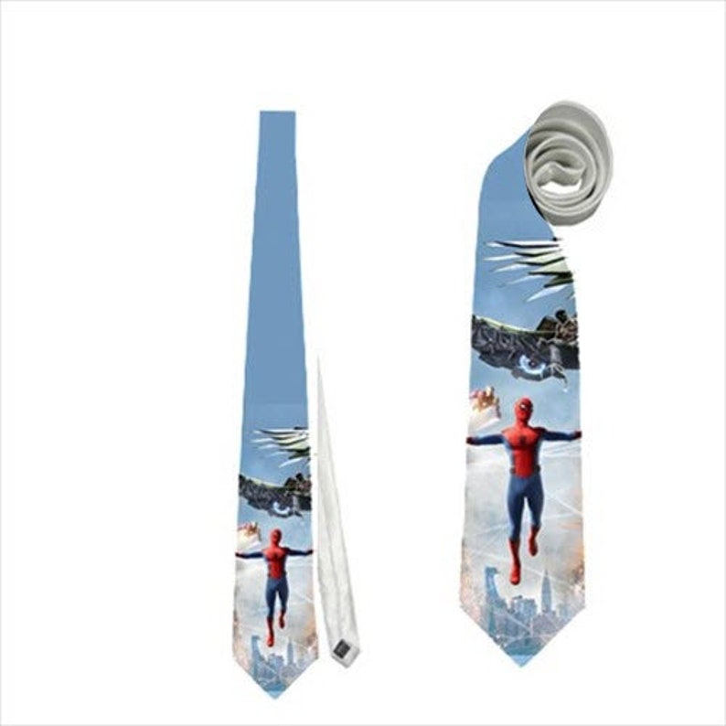 May include: A light blue necktie featuring a Spiderman graphic. The tie has a repeating pattern of the superhero in action, with a cityscape and aircraft in the background. The tie is made of a smooth, likely woven, material.