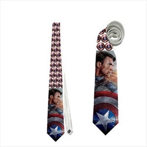 May include: A Captain America themed necktie. The tie features a repeating pattern of Captain America's shield and a portrait of Captain America. The tie is blue, red, white, and silver.