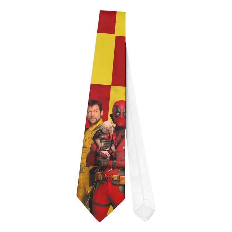 May include: A necktie featuring a red and yellow checkered pattern on the top portion. The tie displays images of two characters from a movie, one in a red suit and mask, and the other in a yellow suit.