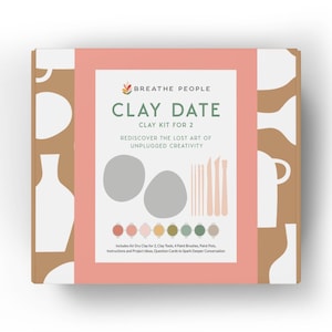 May include: A pink and brown box with the words "BREATHE PEOPLE CLAY DATE CLAY KIT FOR 2 REDISCOVER THE LOST ART OF UNPLUGGED CREATIVITY" on the front. The box includes air dry clay, clay tools, paint brushes, paint pots, instructions, and project ideas.