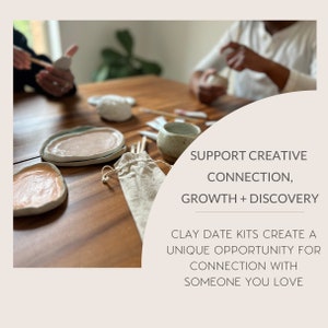 May include: A close-up of a wooden table with clay pottery pieces, a small bag, and wooden sticks. The text "SUPPORT CREATIVE CONNECTION, GROWTH + DISCOVERY CLAY DATE KITS CREATE A UNIQUE OPPORTUNITY FOR CONNECTION WITH SOMEONE YOU LOVE" is displayed on a white background.