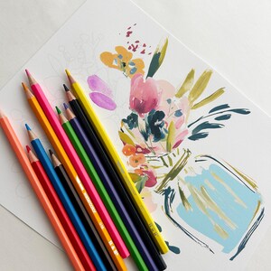 May include: A set of colored pencils in shades of orange, blue, yellow, green, purple, and black arranged diagonally next to a white paper featuring a partially painted floral arrangement in a vase with pink, yellow, and blue brushstrokes.