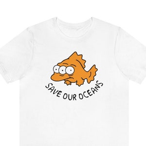 May include: White t-shirt with a cartoon orange fish with four eyes and the text "Save Our Oceans".
