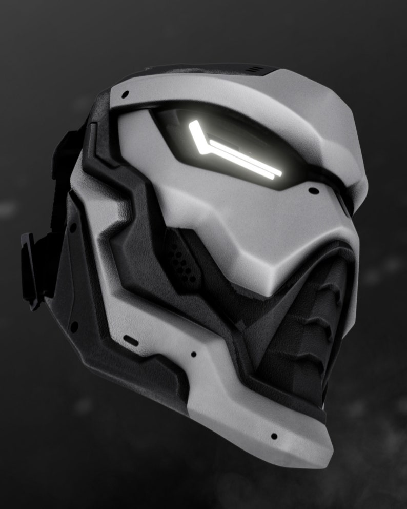 May include: A futuristic, white and black helmet with a glowing white light on the front. The helmet has a geometric design and a black visor.
