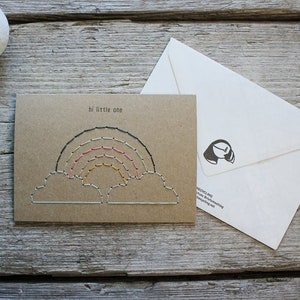 Hand stitched hi little one baby and expecting card with rainbow design on brown paper and with a white map envelope by Misprinted Mind.