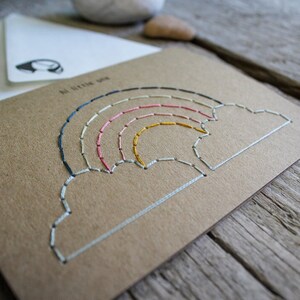 Hand stitched new born baby card with reusable design thanks to its replaceable inner sheet.