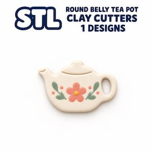 May include: A cream-colored clay cutter shaped like a round belly teapot with a pink flower, yellow center, and green leaves printed on the front. The text above reads STL ROUND BELLY TEA POT CLAY CUTTERS 1 DESIGNS.