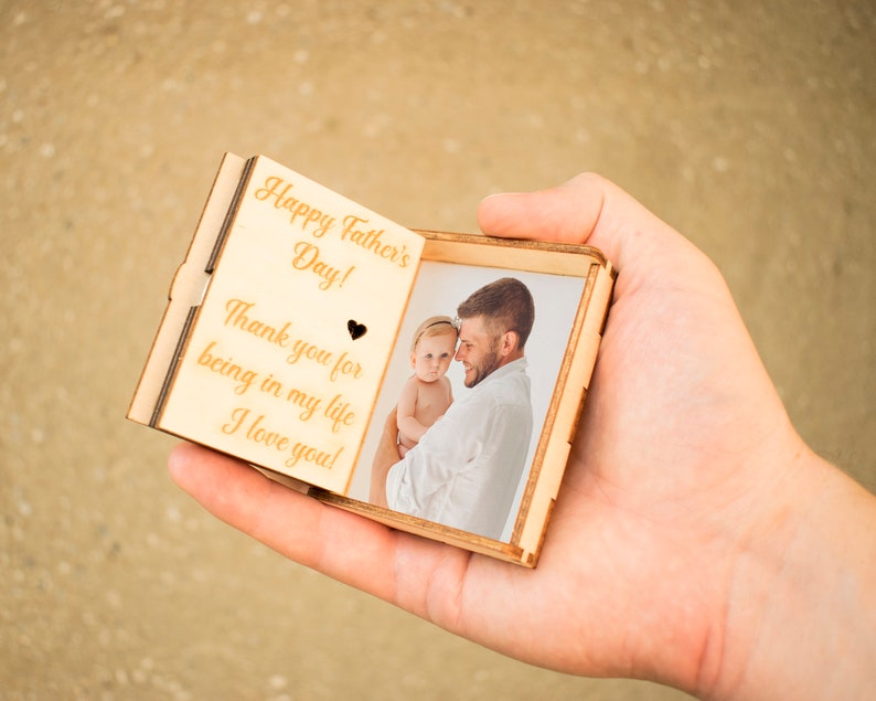 Music box of bright wood with the text Happy Father's day and the picture of dad and baby