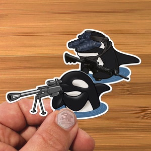 May include: Two black and white orca whales with guns. One orca is wearing a black helmet with night vision goggles. The orcas are holding rifles and are in a cartoon style.