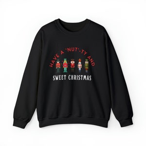 Quebra-nozes Natal - Saudação de Natal 'Nut'-ty and Sweet"Moletom com gola redonda unissex Heavy Blend™