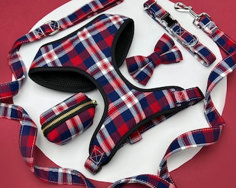 May include: Red and blue plaid dog harness with matching leash, bow tie, and poop bag holder.