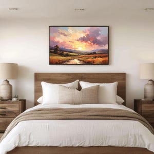 May include: A bedroom scene featuring a bed with a wooden headboard, white bedding, and a brown throw blanket. Two wooden nightstands flank the bed, each with a lamp and decorative items. A landscape painting hangs above the bed.