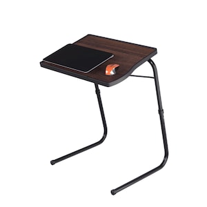 May include: A portable laptop table with a dark brown wood-effect surface and black frame. A black tablet and orange computer mouse are on the table. The table's legs are adjustable for height.