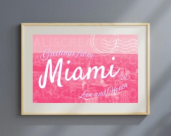 May include: A rectangular framed print featuring a pink gradient background with a white graphic overlay. The text reads Greetings from Miami, Love and Honor, and OH, accompanied by a white circular postmark stamp design over a city scene.