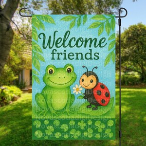 May include: A garden flag with the words "Welcome friends" in green script. The flag features a cartoon frog and ladybug with a daisy on a blue background with green leaves and shamrocks.
