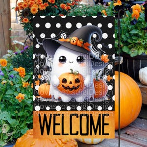 May include: A black and white polka dot welcome sign with a cute ghost holding a jack-o-lantern. The ghost is wearing a witch's hat and is surrounded by pumpkins.