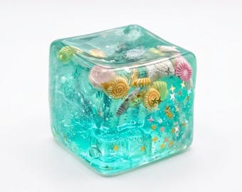 VIRAL Cubo Oceánico Squishy de Crecimiento Lento Moldeable Juguete Antiestrés Cubo de Azúcar Maltosa Transparente con Purpurina