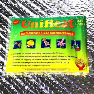 May include: A yellow and green UniHeat Multi-Purpose Jumbo Shipping Warmer with a 72+ hour heat release. The warmer is designed for shipping live insects, reptiles, tropical fish, flowers, and other items. It provides an average warmer surface temperature of 100° F (38° C).